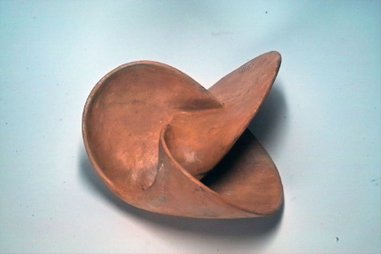 Two-sided surface with the clover leaf sling as boundary curve