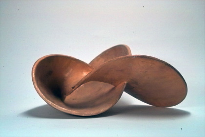 Two-sided surface with the clover leaf sling as boundary curve