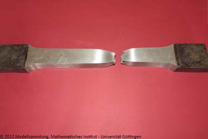 Torsion experiment with a zinc bar, acerous crystals formed at pouring of the bar